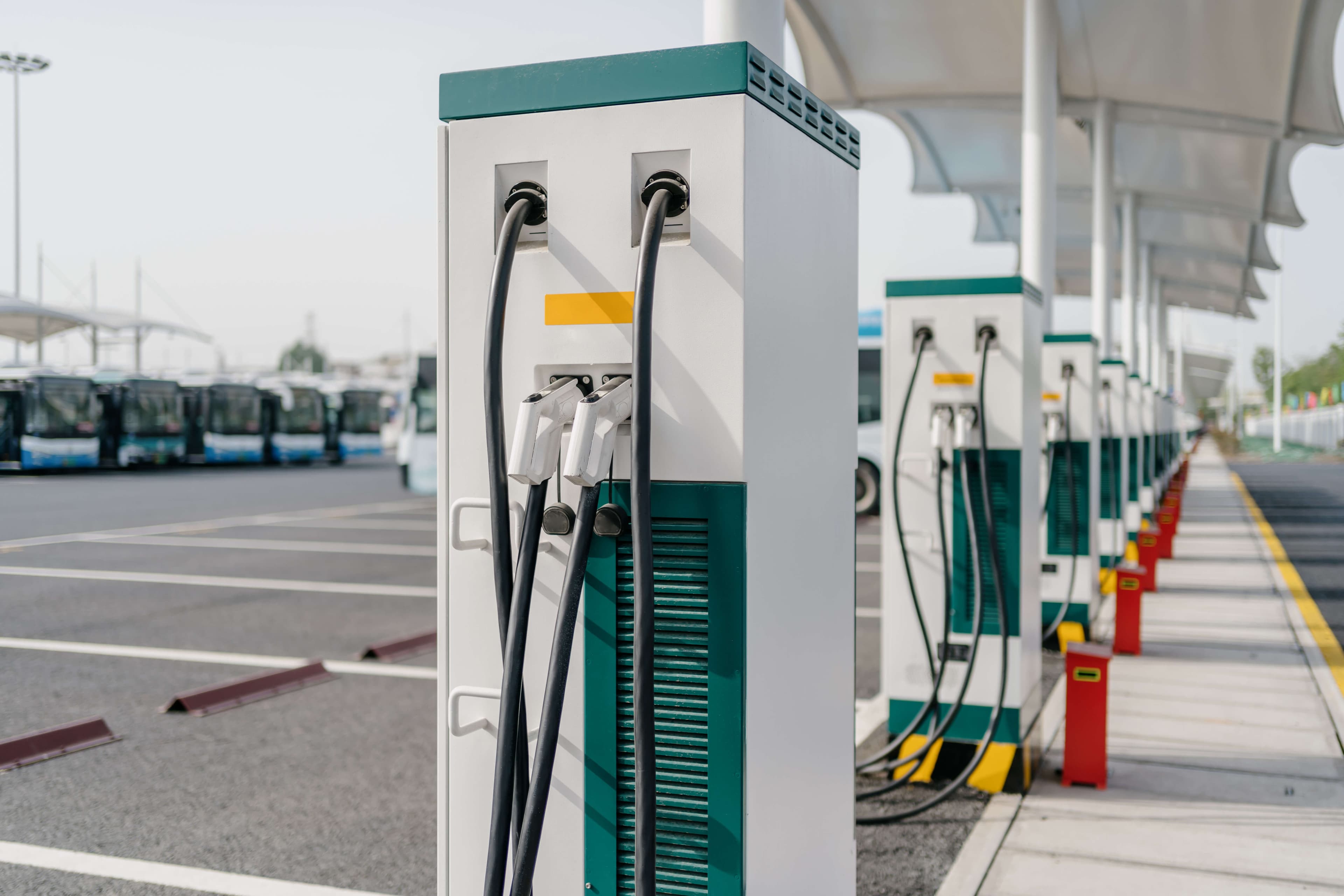 Fleet electric vehicle charging stations at a commercial facility
